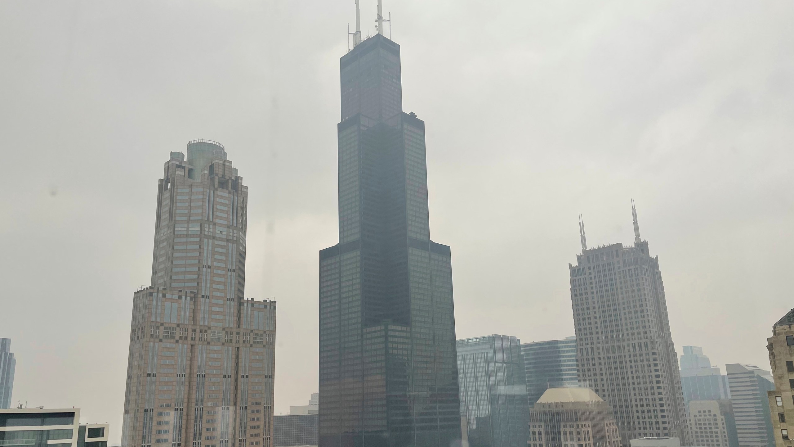 FILE - The Willis Tower (formerly Sears Tower) is pictured in downtown Chicago, where the air quality has been categorized "unhealthy" by the U.S. Environmental Protection Agency, on June 27, 2023. The EPA says extensive swaths of the northern United States awoke to unhealthy air quality Monday, July 17, or were experiencing it by midafternoon. Fine particle pollution caused by smoke from Canada’s wildfires is causing a red zone air quality index, meaning it is unhealthy for everyone. (AP Photo/Claire Savage, file)