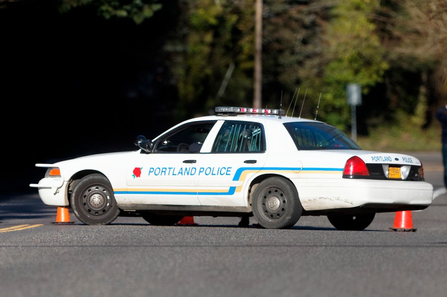 FILE - A Portland police vehicle is parked at a crime scene in Portland, Ore., on March 12, 2014. Authorities in Oregon say the deaths of four women whose bodies were found over three months starting in February 2023, with the last one found in May, are linked and that at least one person of interest has been identified. In Portland, the Multnomah County District Attorney's office says no charges have been filed against anyone but added that the community is not currently in any danger. (Mike Zacchino/The Oregonian via AP, File)