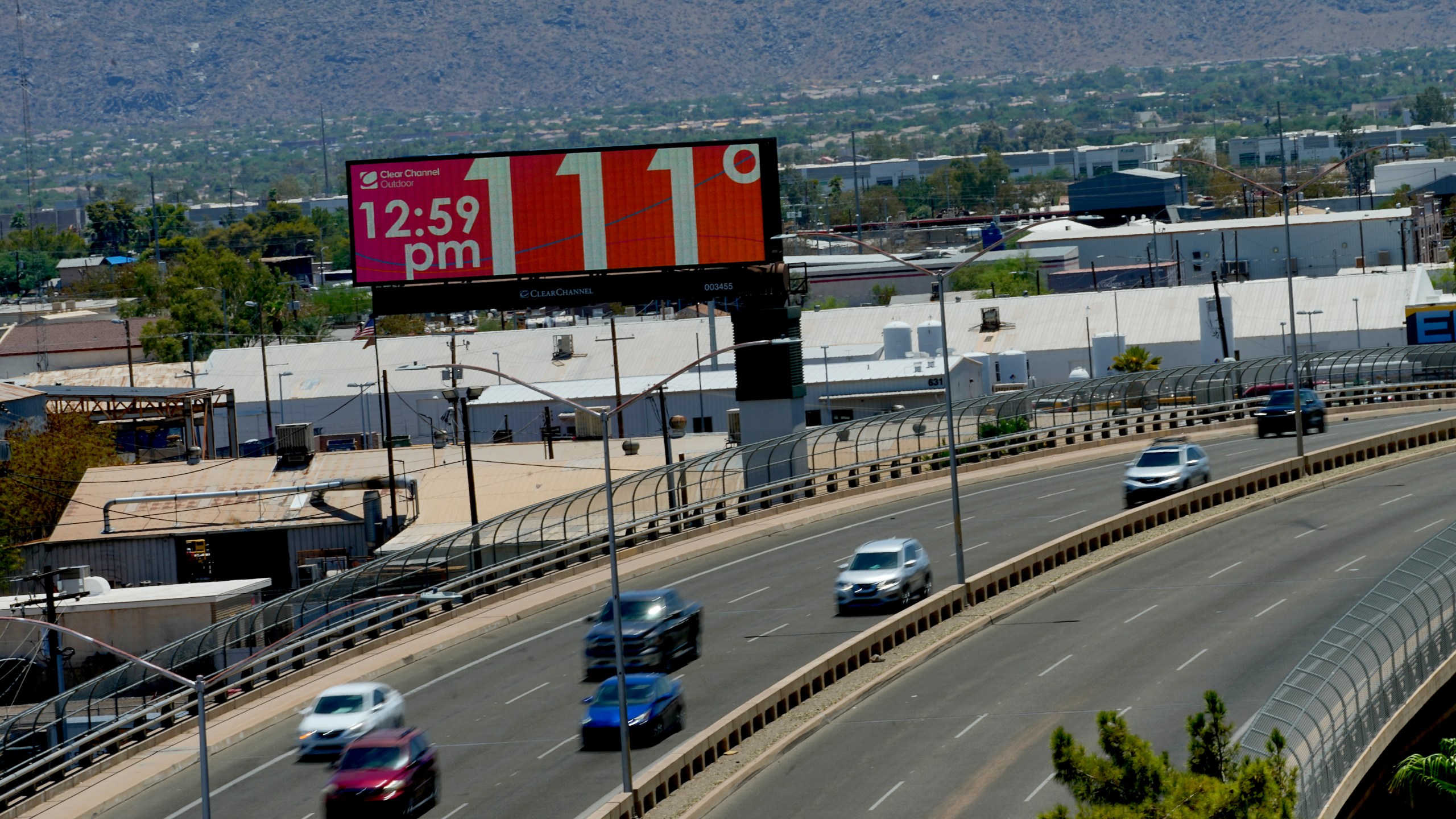 A digital billboard displays an unofficial temperature, Monday, July 17, 2023, in downtown Phoenix. (AP Photo/Matt York)