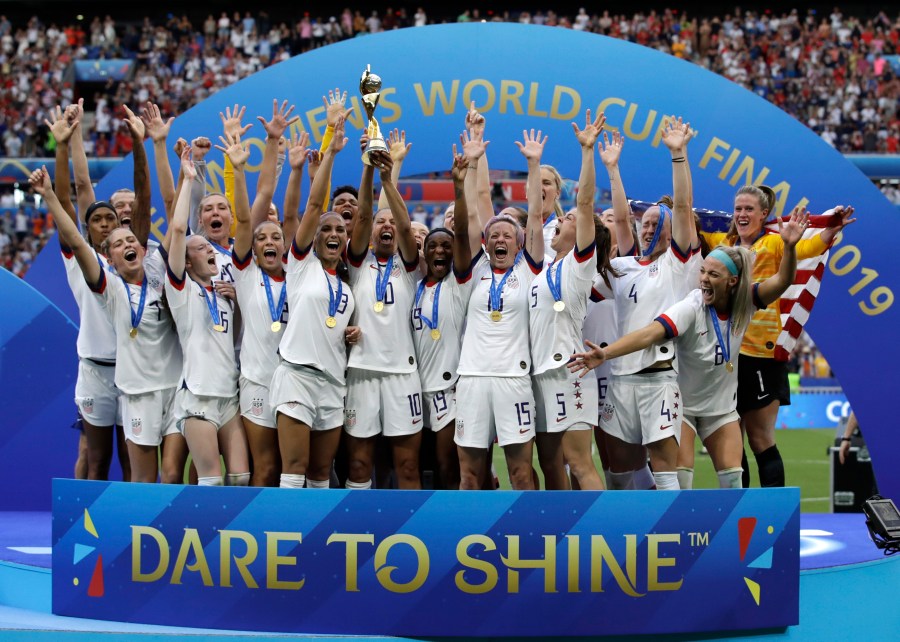 FILE - The United States' team celebrate with the trophy after winning the Women's World Cup final soccer match between against Netherlands at the Stade de Lyon in Decines, outside Lyon, France. (AP Photo/Alessandra Tarantino, File)