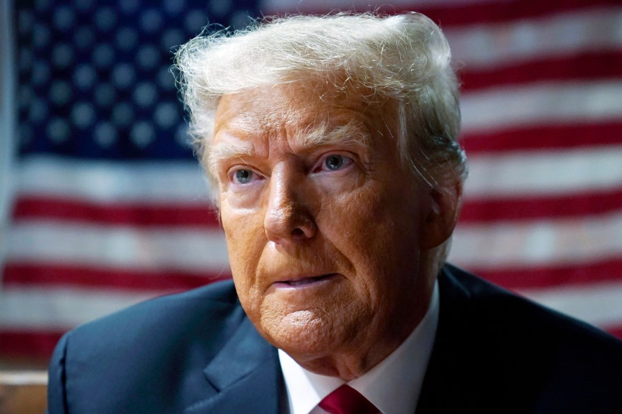 FILE - Former President Donald Trump speaks with supporters at the Westside Conservative Breakfast, June 1, 2023, in Des Moines, Iowa. A federal judge upheld a $5 million jury verdict against Donald Trump on Wednesday, rejecting the former president’s claim that the award was excessive and that a jury in a civil case vindicated him by failing to conclude that he raped a columnist in a luxury department store dressing room in the 1990s. (AP Photo/Charlie Neibergall, File)