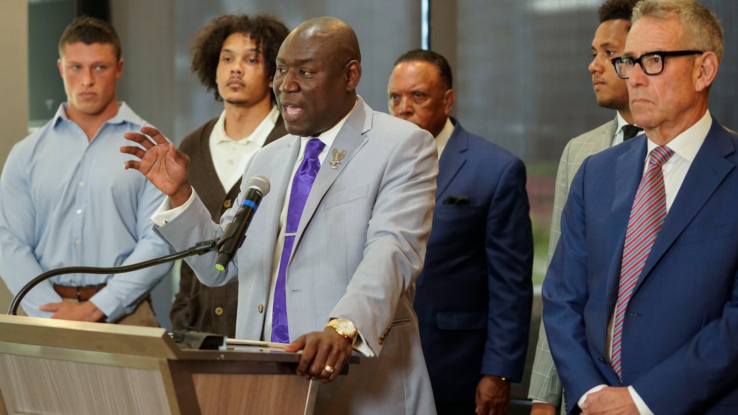 Standing with former Northwestern athletes, attorney Ben Crump speaks during a press conference addressing widespread hazing accusations at Northwestern University Wednesday, July 19, 2023, in Chicago. (AP Photo/Erin Hooley)