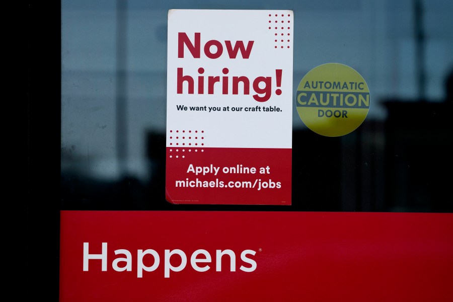 A hiring sign is displayed at a retail store in Downers Grove, Ill., Wednesday, April 12, 2023. On Thursday, the Labor Department reports on the number of people who applied for unemployment benefits last week. (AP Photo/Nam Y. Huh)