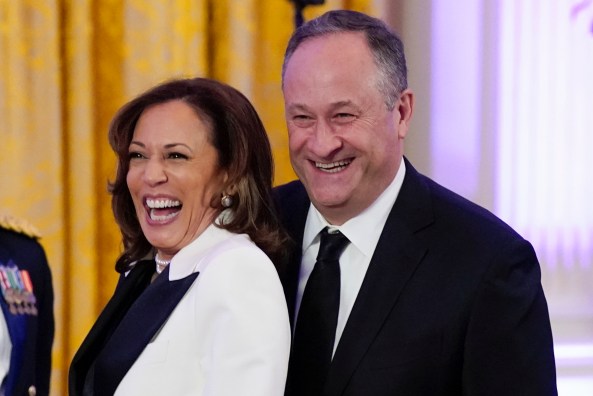 FILE - Vice President Kamala Harris and her husband Doug Emhoff arrive in the East Room of the White House following a dinner reception for the governors and their spouses on Feb. 11, 2023, in Washington. Emhoff met with former New Zealand Prime Minister Jacinda Ardern Friday, July 21, to discuss ways to combat online hate and extremism. (AP Photo/Manuel Balce Ceneta, File)