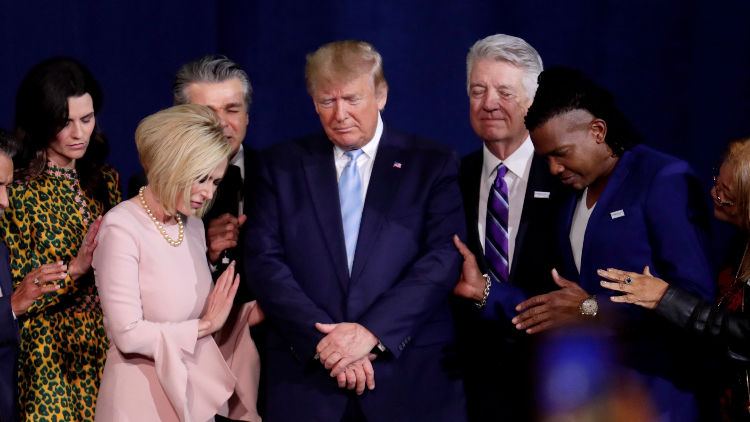 FILE - Pastor Paula White, left, and other faith leaders pray with President Donald Trump, center, during a rally for evangelical supporters at the King Jesus International Ministry church, Friday, Jan. 3, 2020, in Miami. (AP Photo/Lynne Sladky, File)