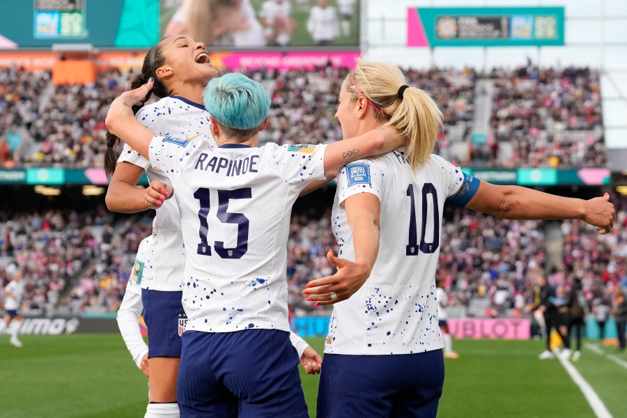 United States' Lindsey Horan, right, celebrates with Sophia Smith, left, and Megan Rapinoe after scoring during the Women's World Cup soccer match between the United States and Vietnam at Eden Park in Auckland, New Zealand, Saturday, July 22, 2023. (AP Photo/Abbie Parr)