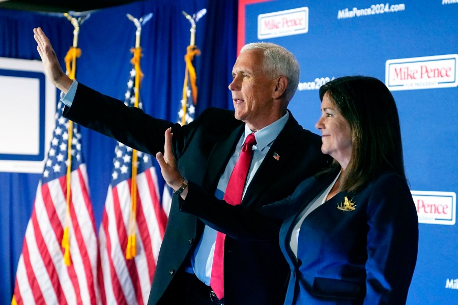 FILE - Republican presidential candidate former Vice President Mike Pence waves after a campaign stop with his wife Karen, June 9, 2023, in Derry, N.H. Weary Republicans who acknowledge Donald Trump's dominance, across New Hampshire are fighting to stop the former president from winning the first-in-the-nation primary. For now, however, they're relying on little more than hope and prayers. Look no further than Pence, who repeatedly appealed to voters' faith as he tried to resurrect his anemic presidential campaign while courting a few dozen voters in a former state lawmaker's backyard. (AP Photo/Charles Krupa, File)