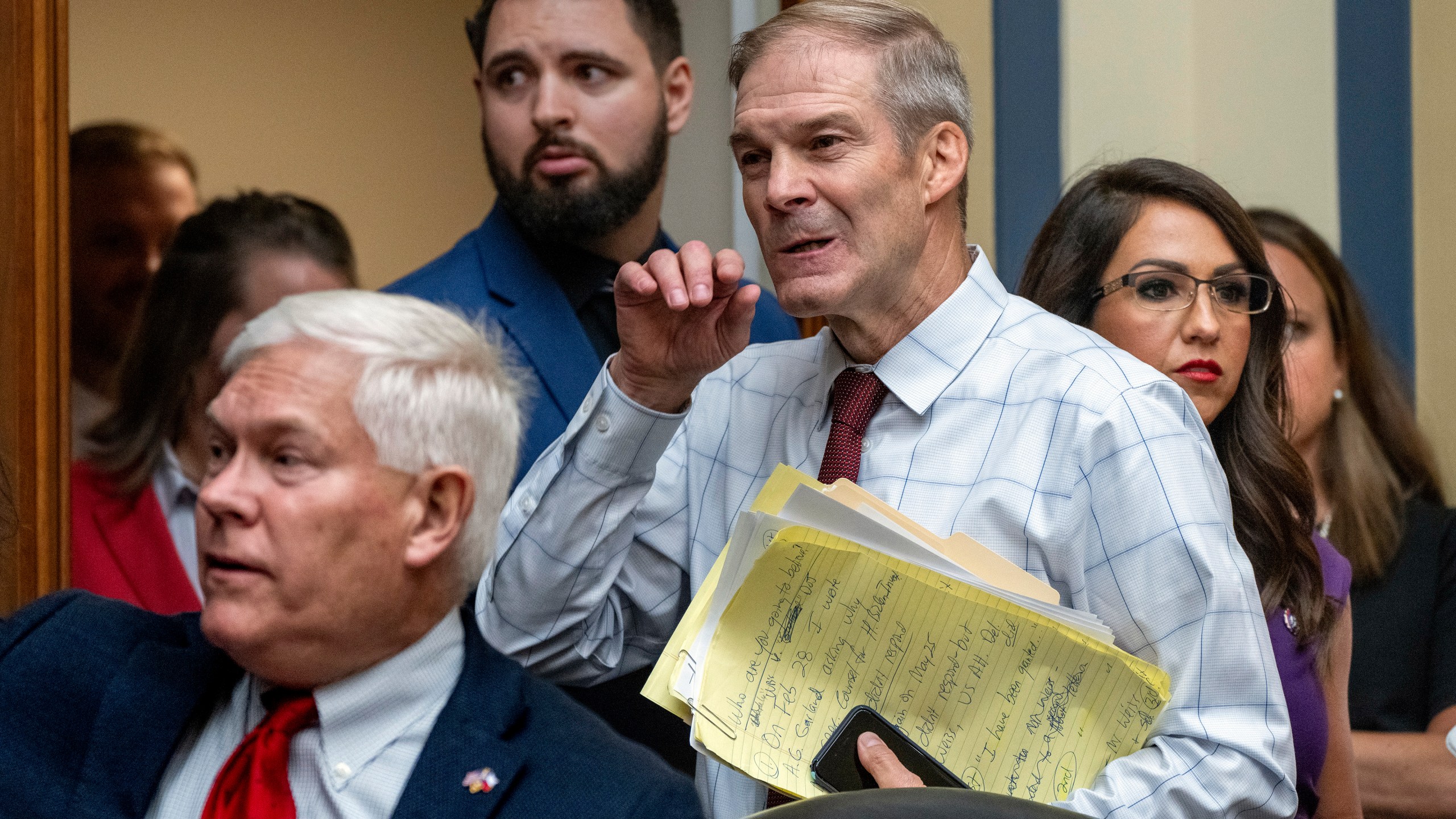 House Judiciary Committee Chair Jim Jordan, R-Ohio, center, flanked by Rep. Pete Sessions, R-Texas, left, and Rep. Lauren Boebert, R-Colo., arrives as the House Oversight and Accountability Committee holds a hearing to charge that the Justice Department interfered with a yearslong investigation into Hunter Biden, at the Capitol in Washington, Wednesday, July 19, 2023. (AP Photo/J. Scott Applewhite)