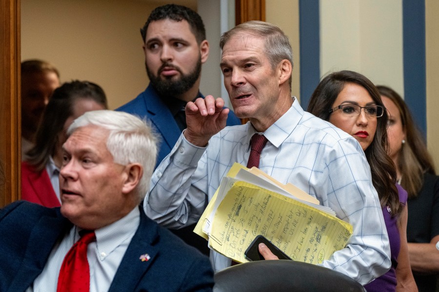 House Judiciary Committee Chair Jim Jordan, R-Ohio, center, flanked by Rep. Pete Sessions, R-Texas, left, and Rep. Lauren Boebert, R-Colo., arrives as the House Oversight and Accountability Committee holds a hearing to charge that the Justice Department interfered with a yearslong investigation into Hunter Biden, at the Capitol in Washington, Wednesday, July 19, 2023. (AP Photo/J. Scott Applewhite)