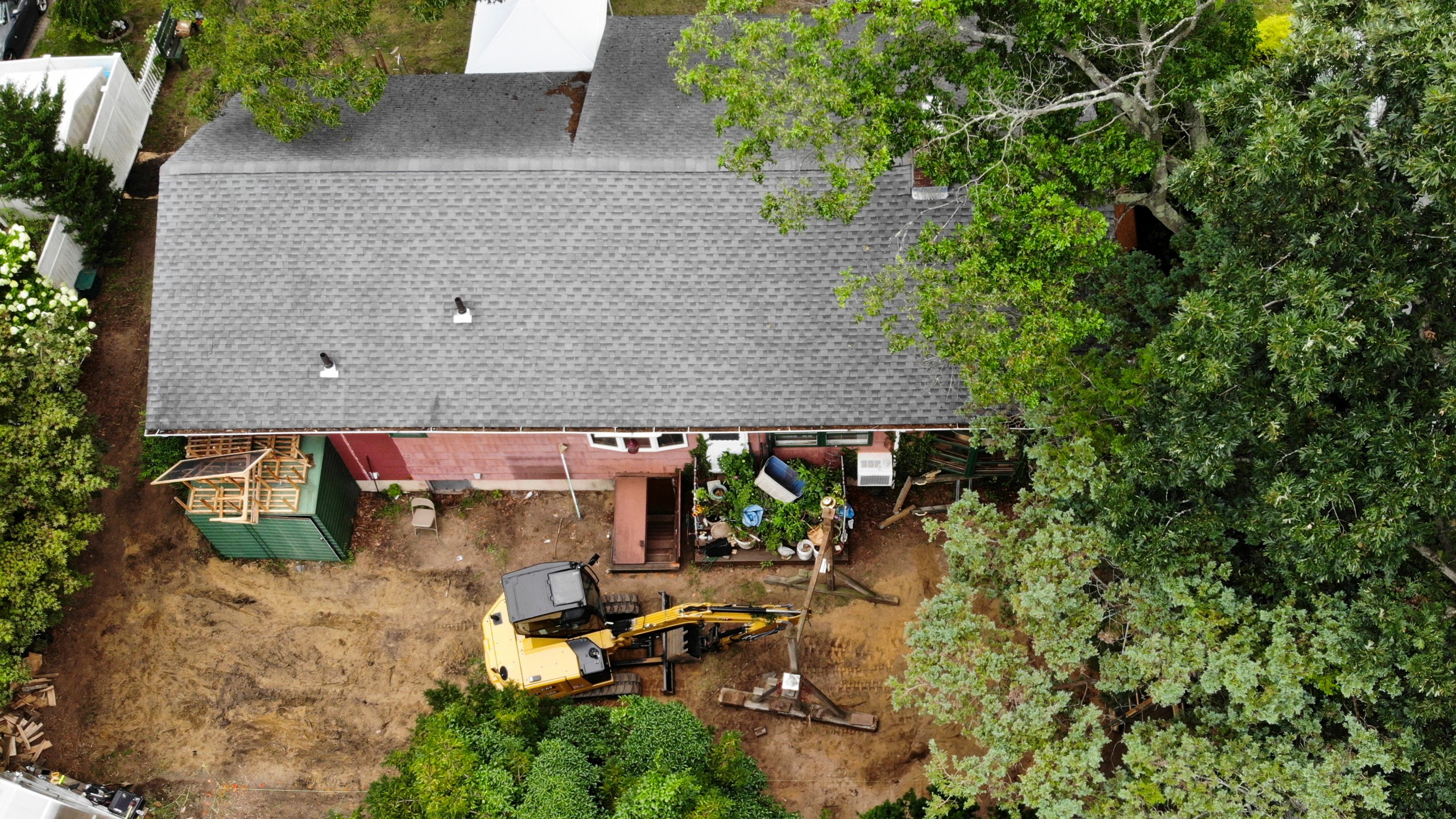 Authorities continue to work at the home of suspect Rex Heuermann in Massapequa Park, N.Y., Monday, July 24, 2023. Heuermann has been charged with killing at least three women in the long-unsolved slayings known as the Gilgo Beach killings. (AP Photo/Seth Wenig)