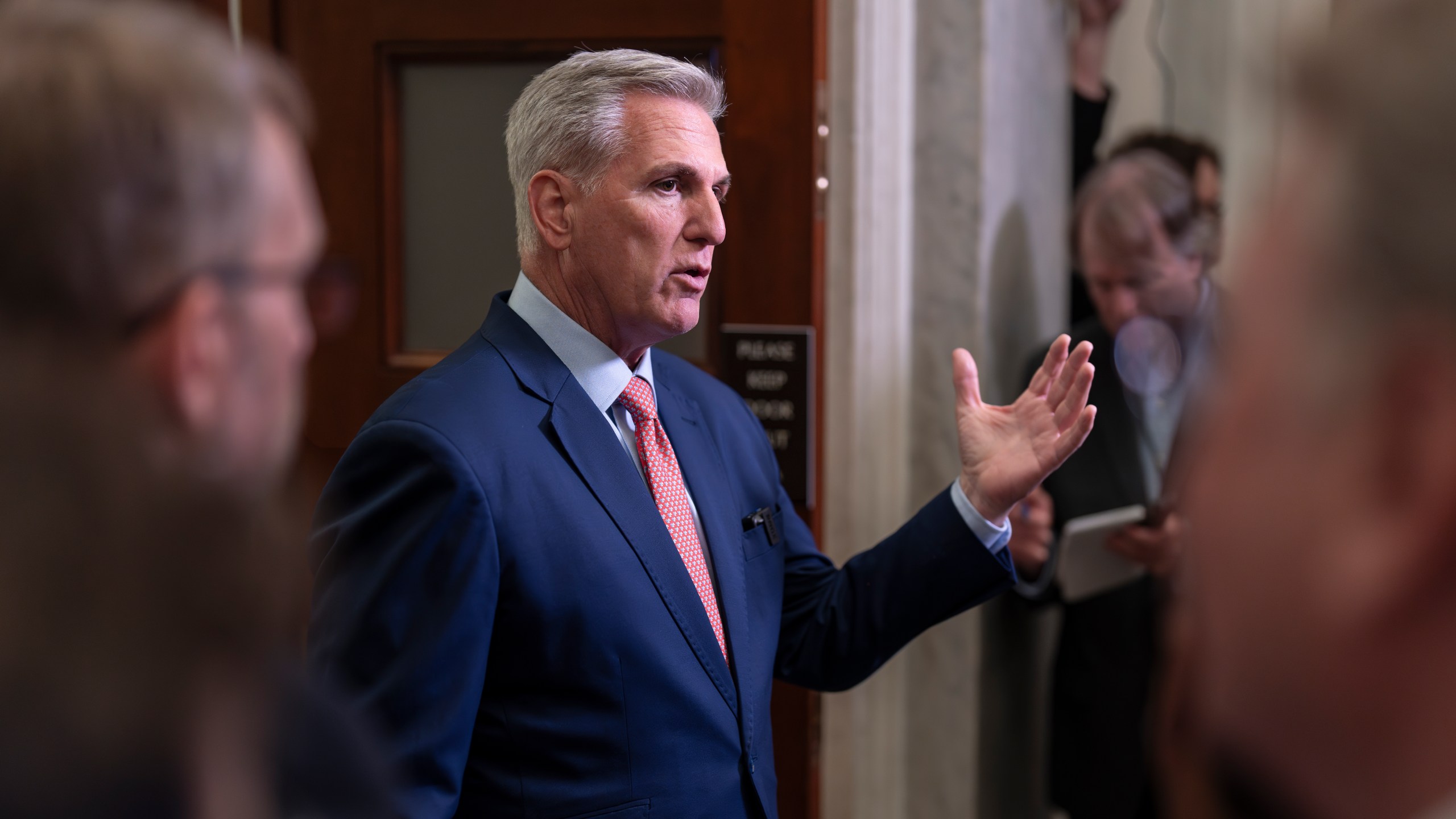 Speaker of the House Kevin McCarthy, R-Calif., talks to reporters outside his office about calls for an impeachment inquiry of President Joe Biden, at the Capitol in Washington, Tuesday, July 25, 2023. (AP Photo/J. Scott Applewhite)