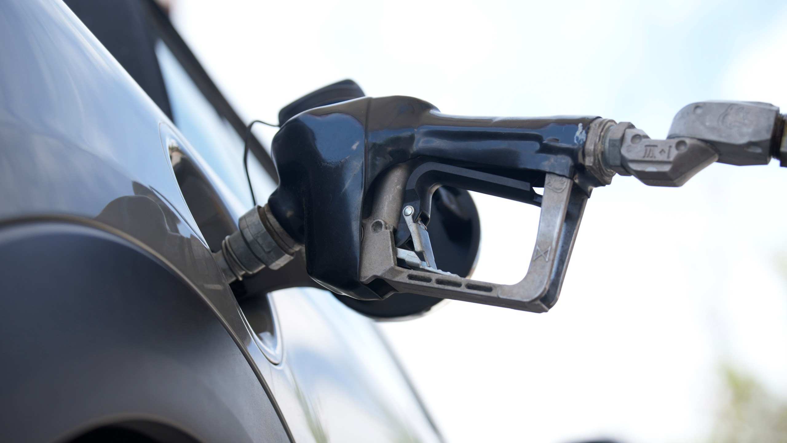 A motorist fills up a vehicle at a Shell gasoline station Sunday, June 18, 2023, in Englewood, Colo. The most-anticipated recession probably in modern U.S. history still hasn't arrived. Despite higher borrowing costs, thanks to the Federal Reserve's aggressive streak of interest rate hikes, consumers keep spending, and employers keep hiring. Gas prices are falling and grocery prices have leveled off, giving Americans more spending power. (AP Photo/David Zalubowski)