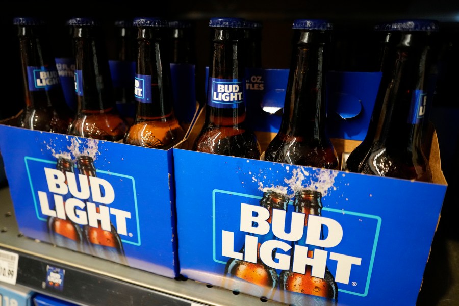 FILE - Bottles of Bud Light beer are seen at a grocery store in Glenview, Ill., April 25, 2023. Anheuser-Busch, the maker of Bud Light, is laying off hundreds of positions across its U.S. corporate staff, the company confirmed this week. The beer maker told the outlets that the layoffs would impact less than 2% of its workforce — which, according to Anheuser-Busch’s website, is made up of 19,000 employees nationwide. (AP Photo/Nam Y. Huh, file)