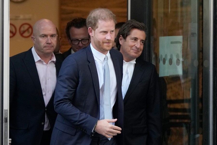 FILE- Prince Harry, centre, and David Sherborne, Prince Harry's lead lawyer, right, leave the High Court after giving evidence in London, Wednesday, June 7, 2023. A London judge has allowed Prince Harry's lawsuit against the publisher of The Sun tabloid to go to trial on claims the newspaper used unlawful methods to gather information about him. (AP Photo/Frank Augstein,File)