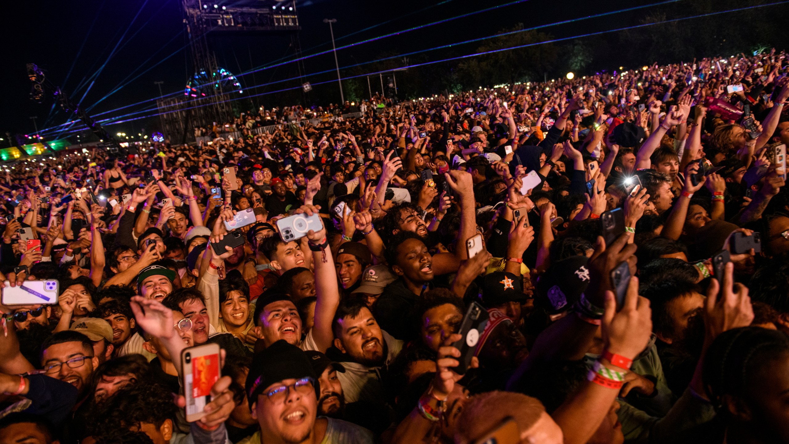 FILE - The crowd watches as Travis Scott performs at Astroworld Festival at NRG park on Friday, Nov. 5, 2021 in Houston. Nearly two years after 10 people were crushed to death during the deadly 2021 Astroworld festival, no charges have been filed despite at least some people, including workers, expressing safety concerns about the event.(Jamaal Ellis/Houston Chronicle via AP, File)