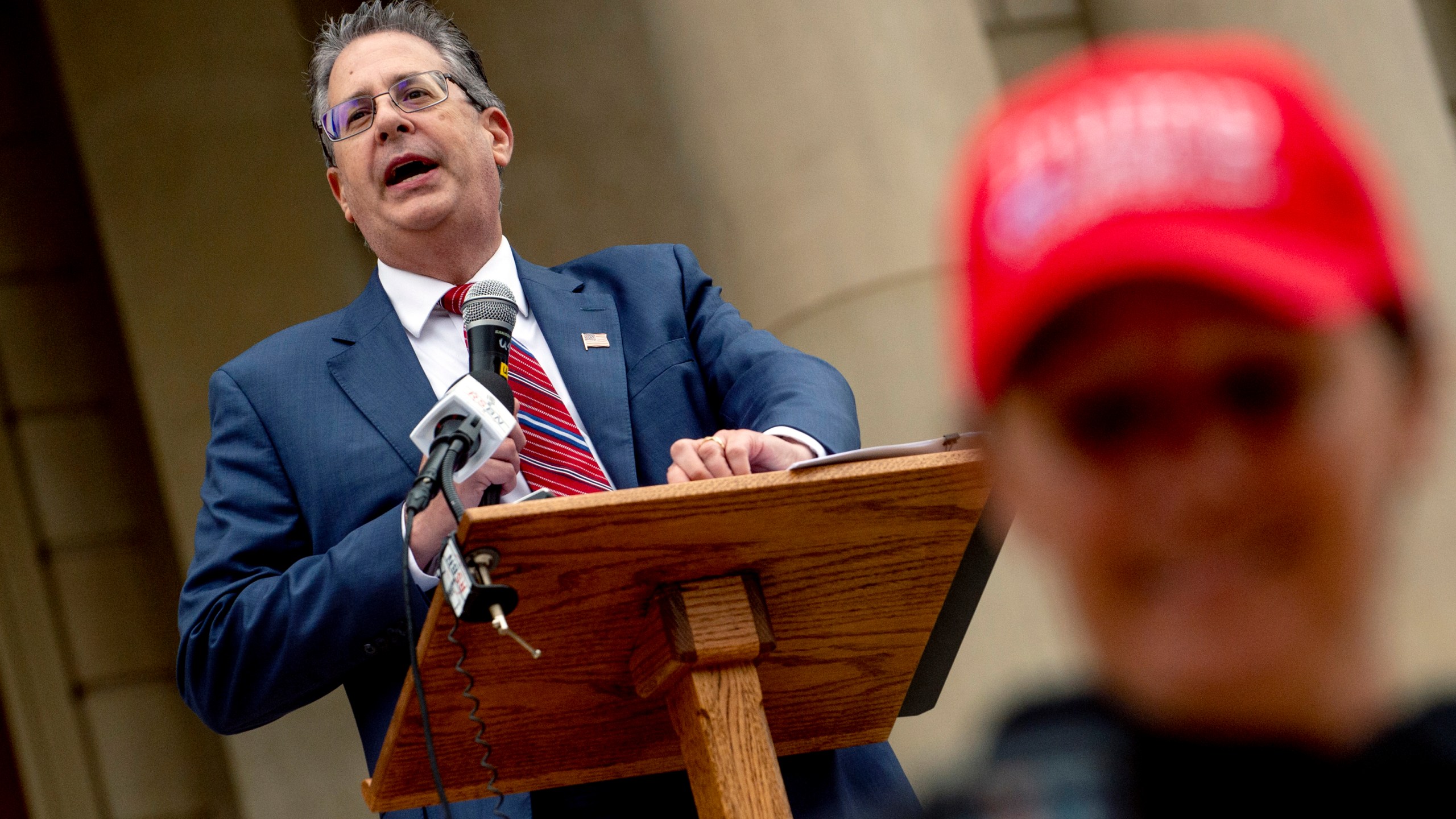 FILE - Matthew DePerno, Republican candidate for Michigan attorney general, speaks during a rally at the Michigan state Capitol, Oct. 12, 2021, in Lansing, Mich. A former Republican attorney general candidate and another supporter of former President Donald Trump have been criminally charged in Michigan in connection with accessing and tampering with voting machines after the 2020 election. DePerno, a lawyer who was endorsed by Trump in an unsuccessful run for Michigan attorney general last year, was arraigned remotely Tuesday Aug. 1, 2023, according to Richard Lynch, the court administrator for Oakland County’s 6th Circuit. (Jake May/The Flint Journal via AP, File)