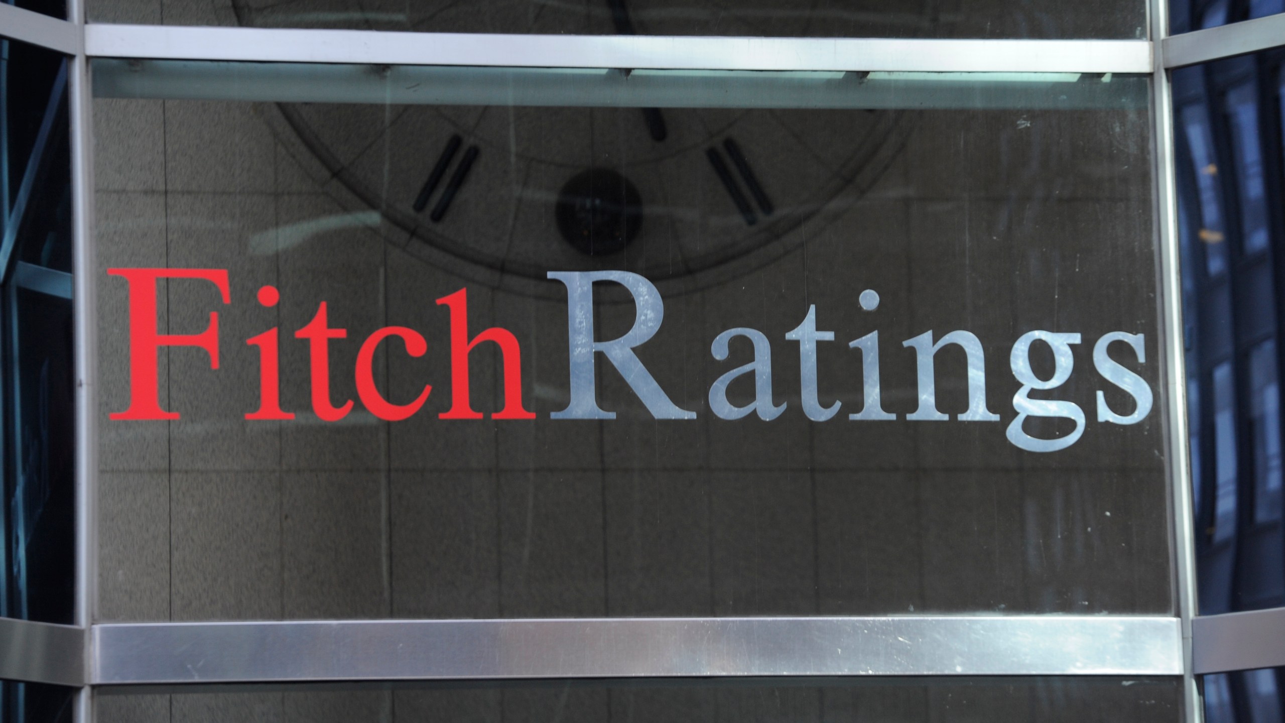 FILE - This photo shows signage for Fitch Ratings, Sunday, Oct. 9, 2011, in New York. On Tuesday, Aug. 1, 2023, Fitch Ratings has downgraded the U.S. credit rating, citing an expected increase in government debt over the next three years and a “steady deterioration in standards of governance” over the past two decades. (AP Photo/Henny Ray Abrams, File)