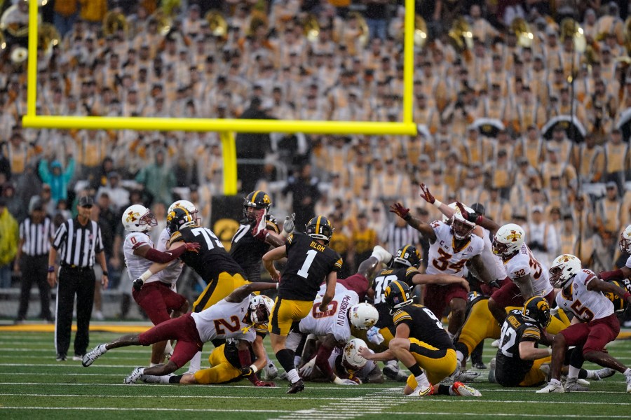 FILE - Iowa place kicker Aaron Blom (1) misses a field goal at the end of an NCAA college football game against Iowa State, Saturday, Sept. 10, 2022, in Iowa City, Iowa. Iowa State won 10-7. A former walk-on kicker at the University of Iowa was charged Wednesday, Aug. 2, 2023, in connection with wagering on Hawkeyes sports events — one day after Iowa State quarterback Hunter Dekkers was accused of committing the same offense. The criminal complaint filed in Johnson County said Aaron Blom, who was on the Iowa roster from 2020-22, tampered with records related to an Iowa Criminal Division investigation into sports gambling. (AP Photo/Charlie Neibergall, File)