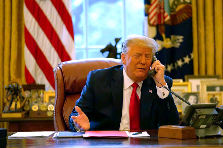 In this image released in the final report by the House select committee investigating the Jan. 6 attack on the U.S. Capitol, President Donald Trump talks on the phone to Vice President Mike Pence from the Oval Office of the White House on Jan. 6, 2021. (House Select Committee via AP)