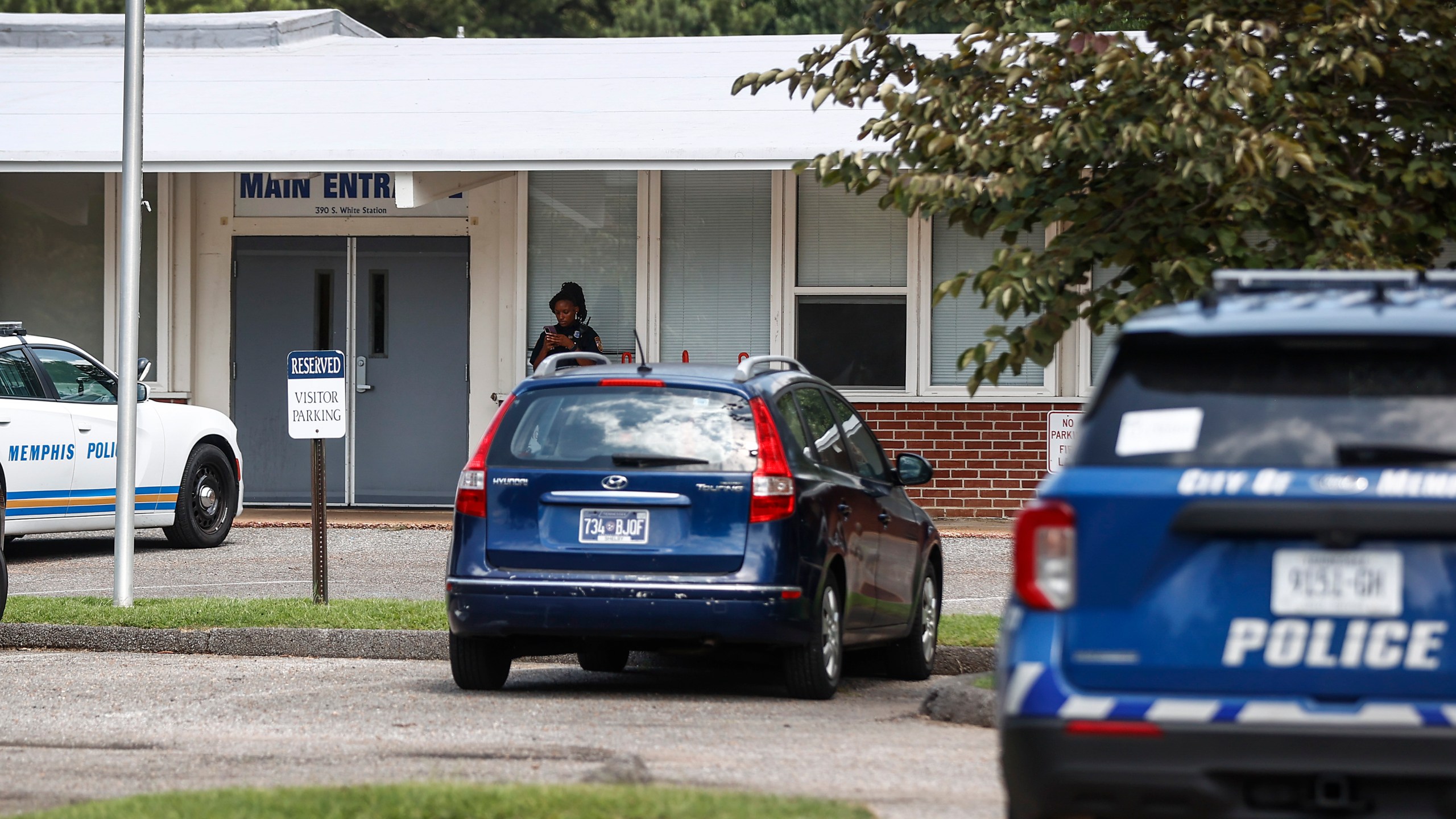 FILE - Memphis police officers work the scene of a shooting at Margolin Hebrew School on Monday, July 31, 2023, in Memphis, Tenn. A man suspected of trying to enter the Jewish school with a gun and firing shots outside the building has been charged with multiple crimes, the lead agency looking into the shooting said Wednesday, Aug. 2, 2023. (Mark Weber/Daily Memphian via AP, File)