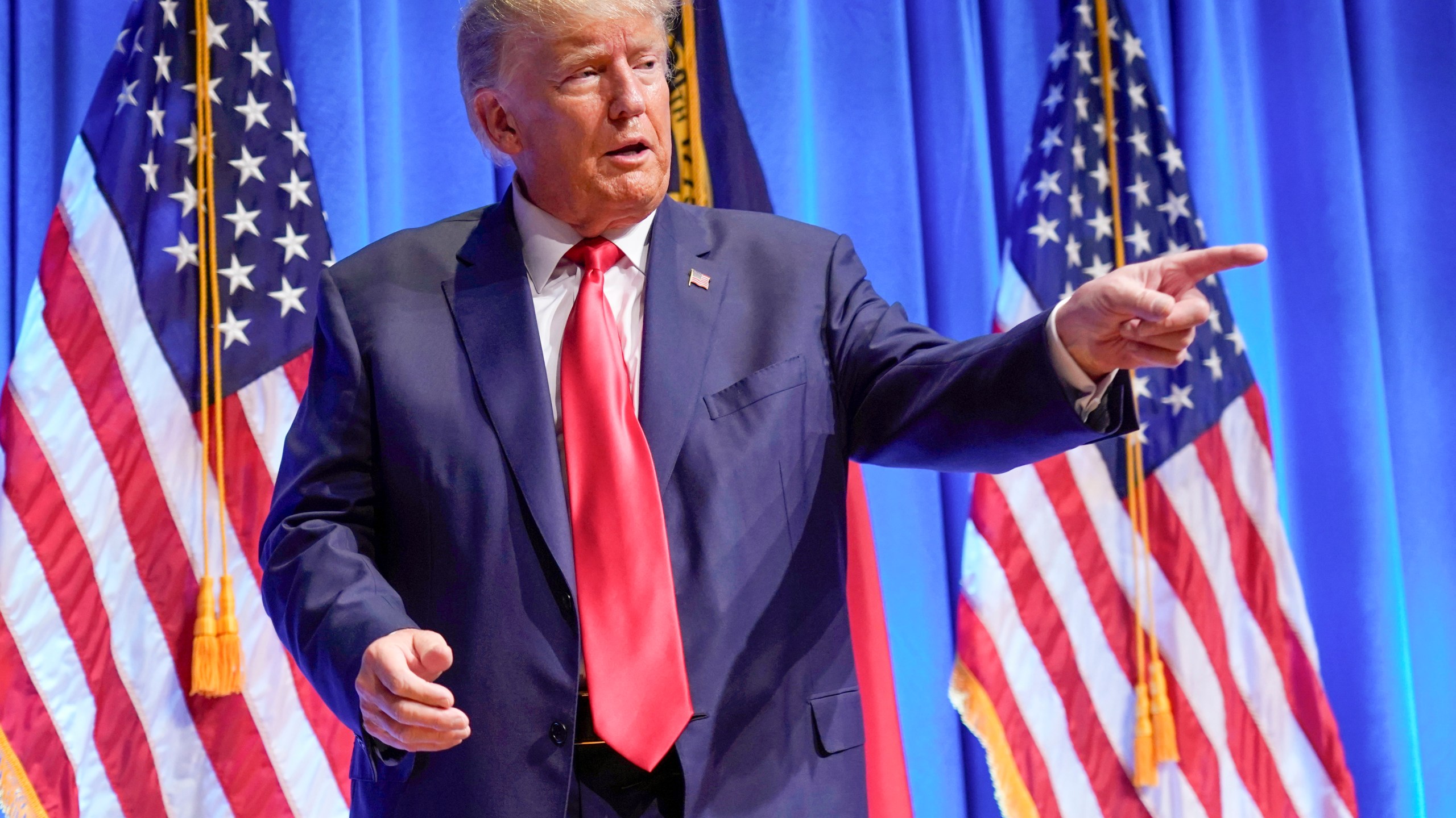 FILE - Former President Donald Trump gestures after speaking during the North Carolina Republican Party Convention in Greensboro, N.C., June 10, 2023. The latest indictment of Donald Trump alleges the former president conspired to overturn the will of voters and disrupt the peaceful transfer of power. Yet Trump's most devoted followers claim these serious criminal charges actually show that Trump is the victim of political persecution. (AP Photo/Chuck Burton, File)