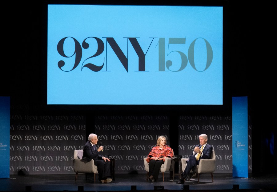 FILE - Former President Bill Clinton, right, and former Secretary of State Hillary Rodham Clinton, center, speak with David Rubenstein at the 92nd Street Y on May 4, 2023, in New York. Oprah Winfrey, Rachel Maddow and Arnold Schwarzenegger will be among those appearing this fall at the 92nd Street Y, a New York City cultural institution and community center marking its 150th anniversary. (Photo by Evan Agostini/Invision/AP, File)