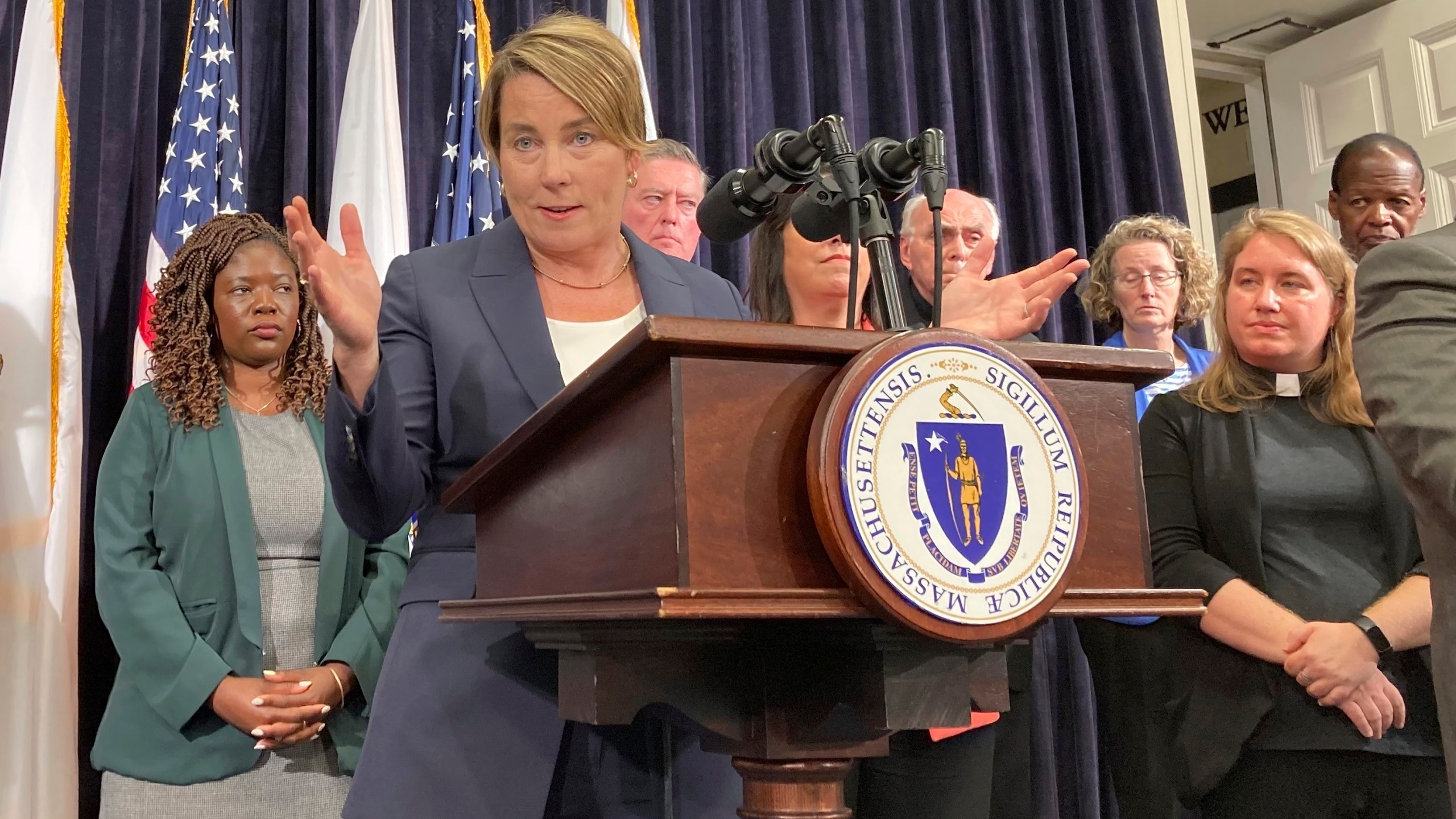 Massachusetts Gov. Maura Healey declares a state of emergency Tuesday, Aug. 8, 2023 in Boston, citing the influx of migrants to the state in need of shelter. Healey said there are nearly 5,600 families or more than 20,000 individuals – many of whom are migrants -- currently living in state shelter across Massachusetts. That's up from around 3,100 families a year ago, about an 80 percent increase. (AP Photo/Steve LeBlanc)