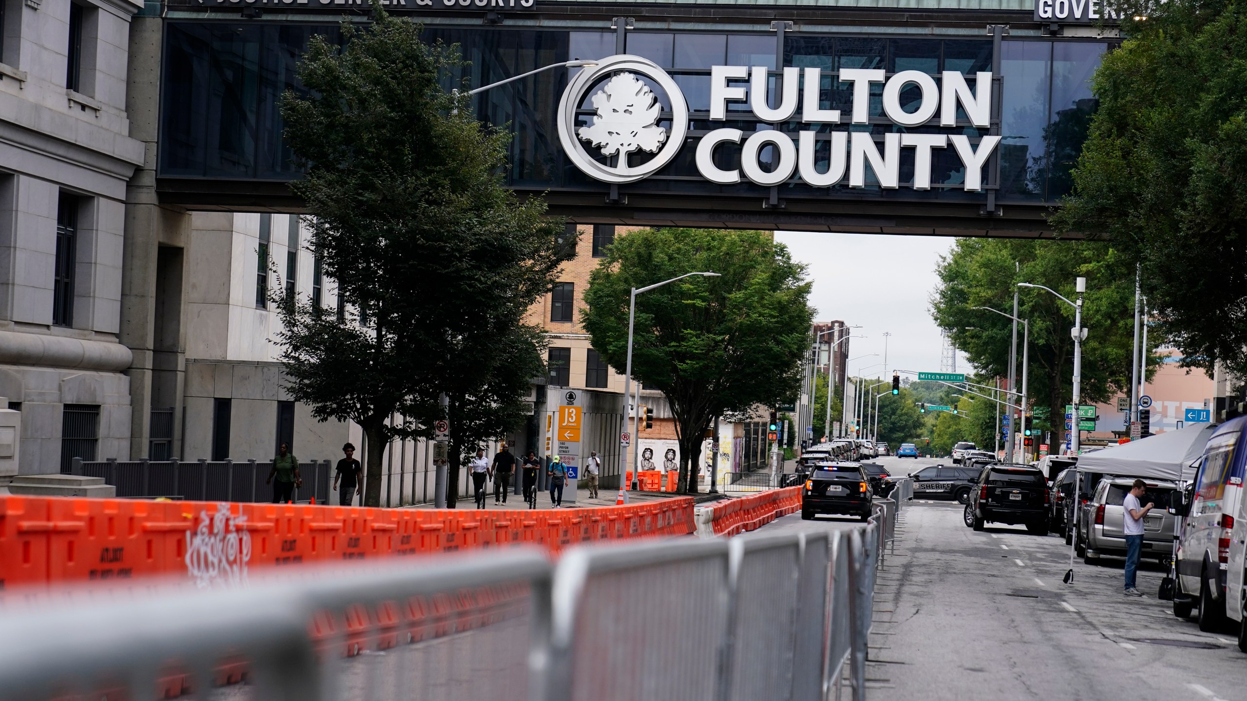 Barricades are seen near the Fulton County courthouse, Monday, Aug. 7, 2023, in Atlanta. The sheriff's office are implementing various security measures ahead of District Attorney Fani Willis possibly seeking an indictment in her investigation into whether former President Donald Trump and his allies illegally meddled in the 2020 election in Georgia. (AP Photo/Brynn Anderson)