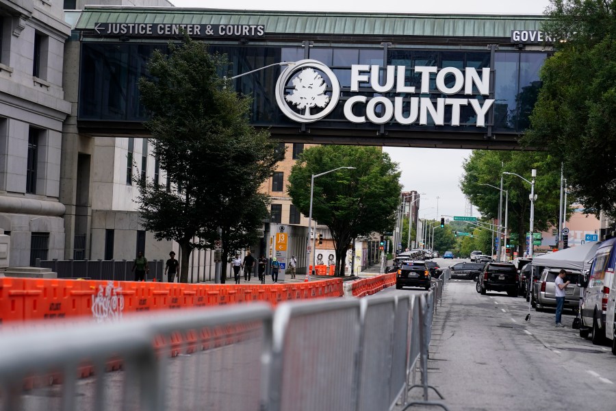 Barricades are seen near the Fulton County courthouse, Monday, Aug. 7, 2023, in Atlanta. The sheriff's office are implementing various security measures ahead of District Attorney Fani Willis possibly seeking an indictment in her investigation into whether former President Donald Trump and his allies illegally meddled in the 2020 election in Georgia. (AP Photo/Brynn Anderson)