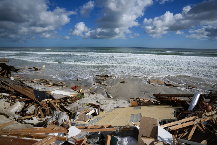 FILE - A piece of wall is seen amid the wreckage of Nina Lavigna's beachfront home, after half of her house collapsed following Hurricane Nicole, Nov. 12, 2022, in Wilbur-By-The-Sea, Fla. Record hot ocean temperatures and a tardy El Nino are doubling the chances of a nasty Atlantic hurricane season this summer and fall, the National Oceanic and Atmospheric Administration said Thursday, Aug. 10, 2023. (AP Photo/Rebecca Blackwell, File)