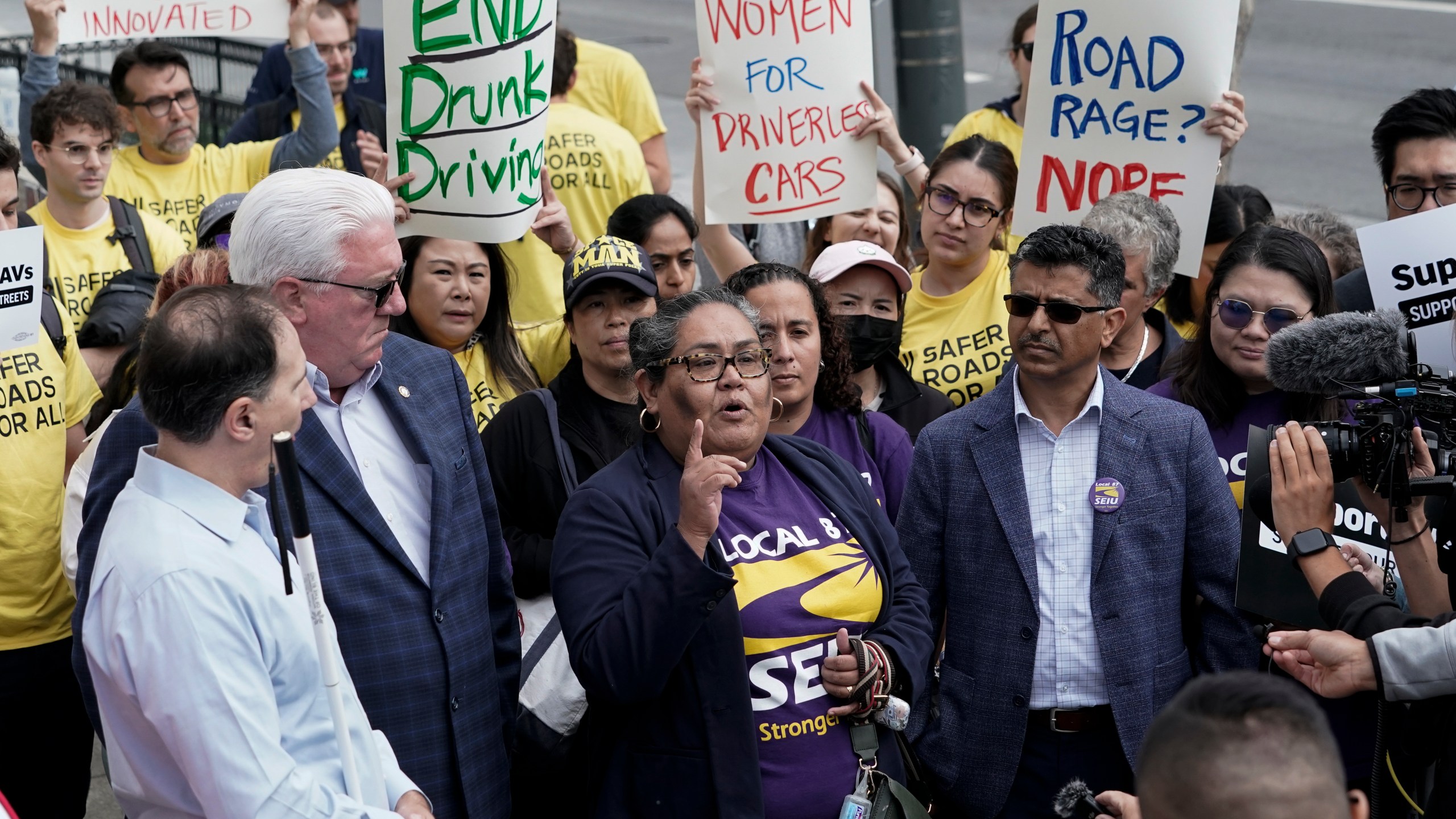 SEIU Local 87 president Olga Miranda, center, speaks in support of a proposed robotaxi expansion on Thursday, Aug. 10, 2023, in San Francisco. (AP Photo/Godofredo A. Vásquez)