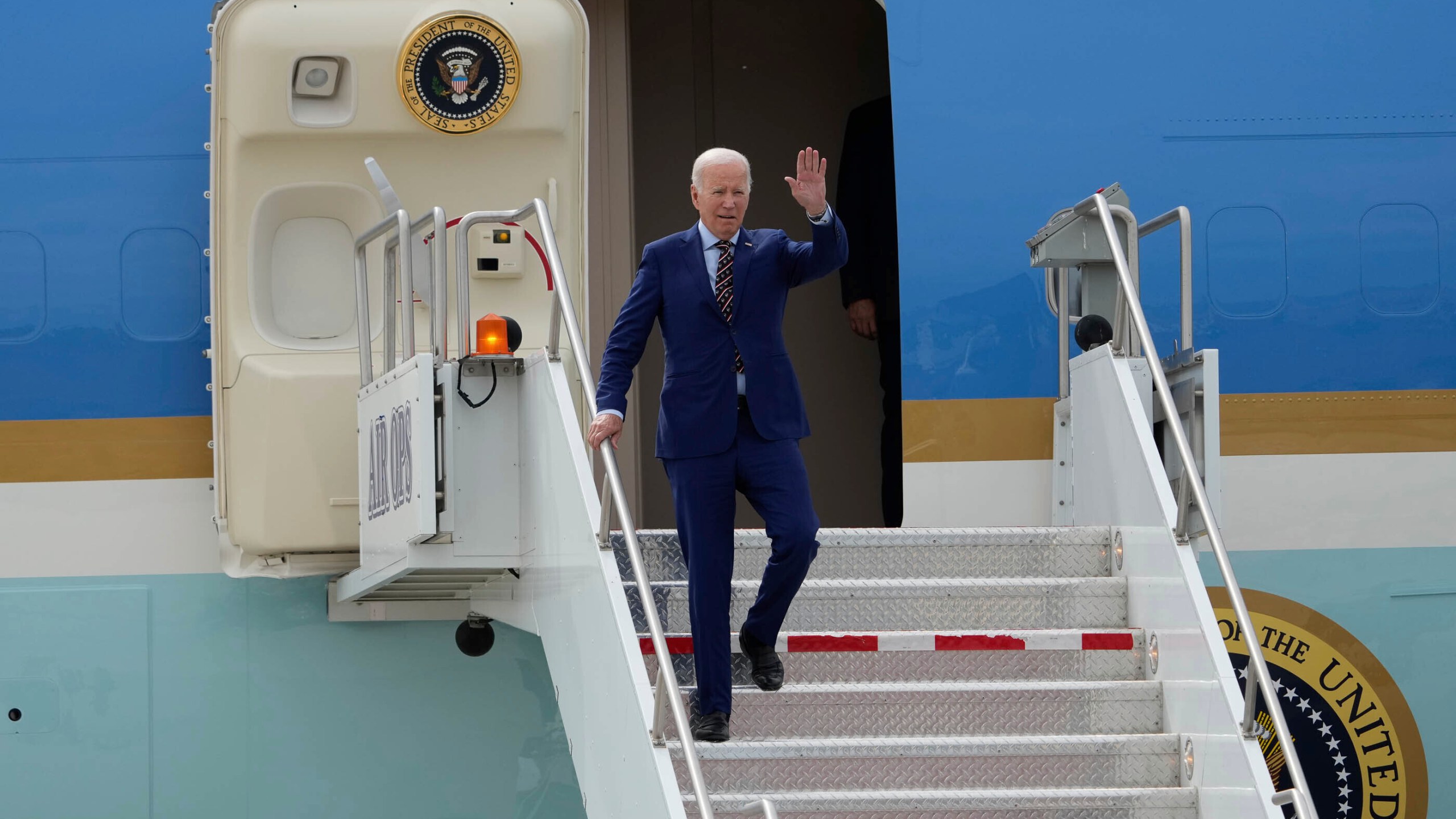 President Joe Biden exits Air Force One after landing at Roland R. Wright Air National Guard Base, Wednesday, Aug. 9, 2023, in Salt Lake City. (Francisco Kjolseth/The Salt Lake Tribune via AP)