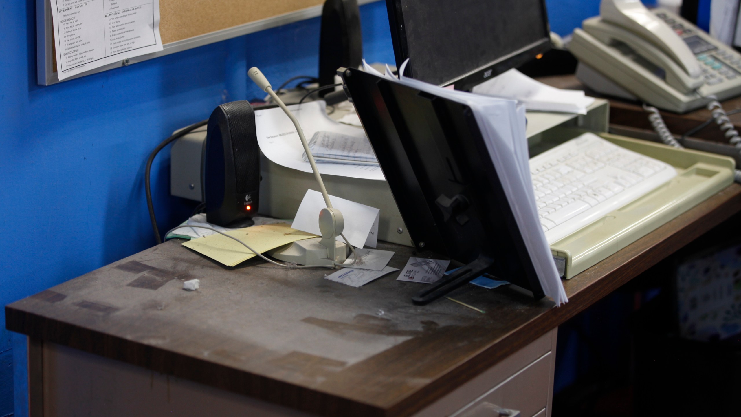 An empty spot on reporter Phyllis Zorn's desk shows where the tower for her computer sat before law enforcement officers seized it in a raid on the Marion County Record, Sunday, Aug. 13, 2023, in Marion County, Kan. Editor and Publisher Eric Meyer says the raid was designed to intimidate the newspaper as it investigated local issues. (AP Photo/John Hanna)