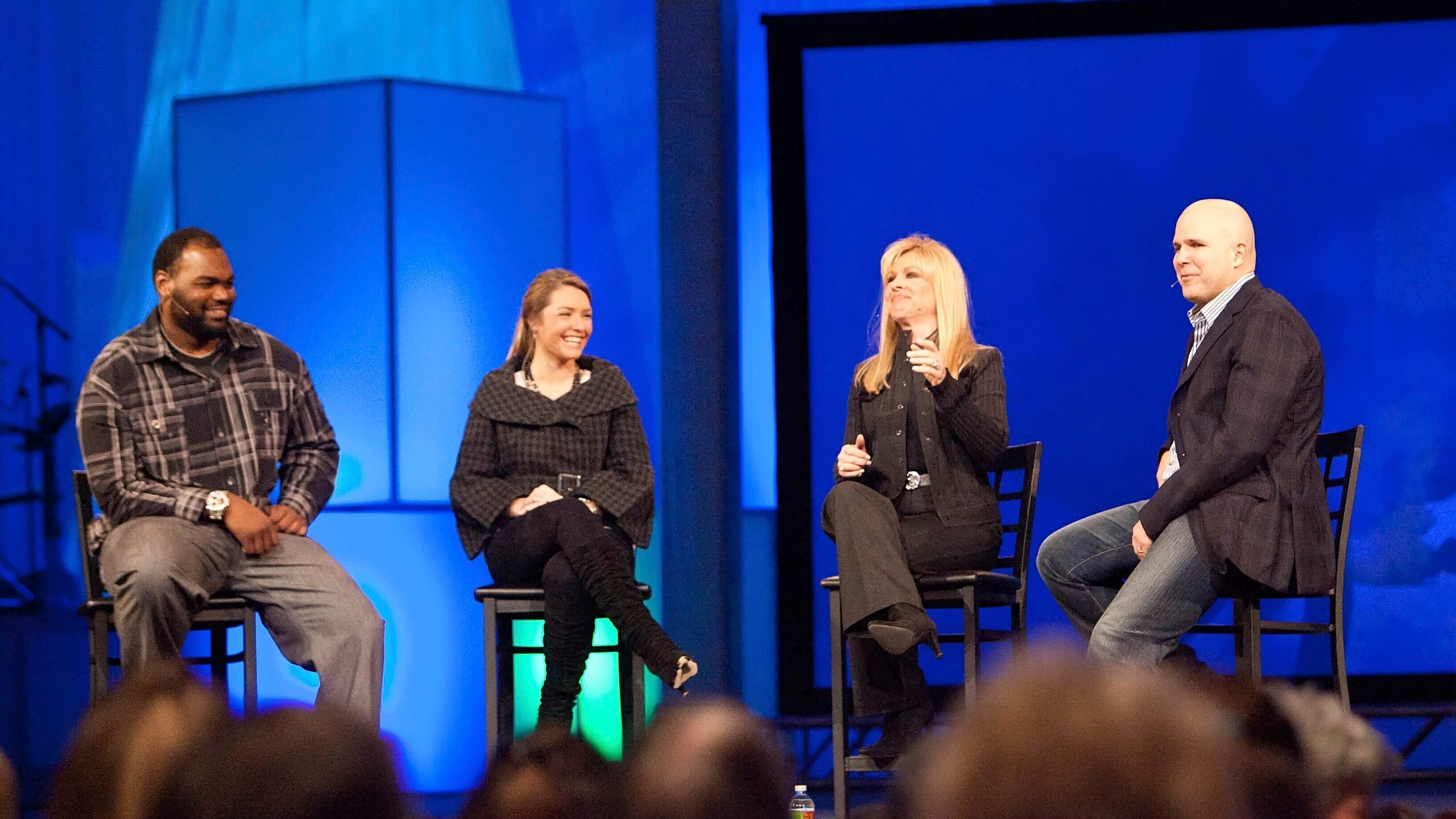 FILE - Michael Oher, left, Collins Tuohy, second from left, and Leigh Anne Tuohy, whose lives are portrayed in the Oscar-nominated movie "The Blind Side," speak with Pastor Kerry Shook, right, March 3, 2010 at Woodlands Church's Fellowship Campus in The Woodlands, TX. Michael Oher, the former NFL tackle known for the movie “The Blind Side,” filed a petition Monday, Aug. 14, 2023, in a Tennessee probate court accusing Sean and Leigh Anne Tuohy of lying to him by having him sign papers making them his conservators rather than his adoptive parents nearly two decades ago. (AP Photo/The Courier, Eric S. Swist, File)