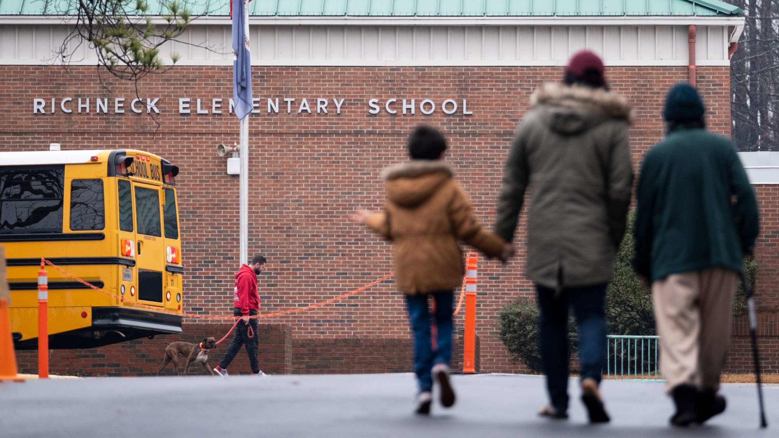 FILE - Students return to Richneck Elementary in Newport News, Va., on Jan. 30, 2023. The mother a 6-year-old who shot his teacher in Virginia is expected to plead guilty Tuesday, Aug. 15, 2023, seven months after her son used her handgun in the classroom shooting. (Billy Schuerman/The Virginian-Pilot via AP)