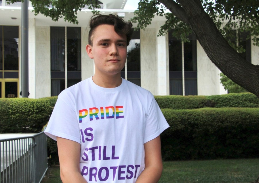 North Carolina State University student and LGBTQ+ rights activist Nathaniel Dibble, 19, poses for a portrait outside the state Legislative Building in Raleigh, N.C., Wednesday, Aug. 16, 2023. Republican state lawmakers will attempt later Wednesday to override the Democratic governor's veto of legislation banning gender-affirming health care for minors. (AP Photo/Hannah Schoenbaum)