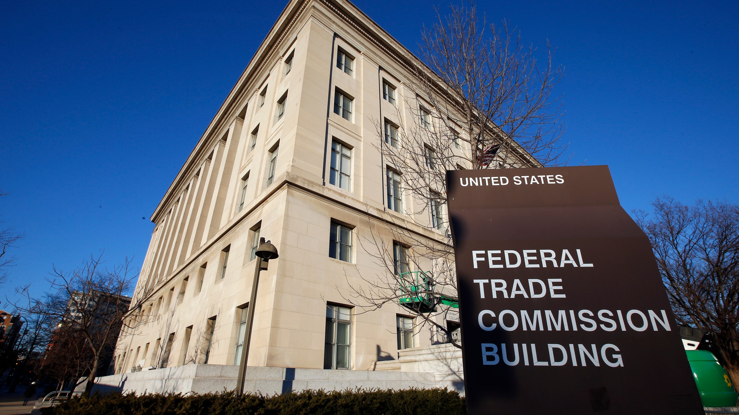 FILE - The Federal Trade Commission building in Washington is shown on Jan. 28, 2015. Financial scams, including cryptocurrency schemes, cost consumers $3.8 billion last year just in the U.S., according to the FTC. (AP Photo/Alex Brandon, File)