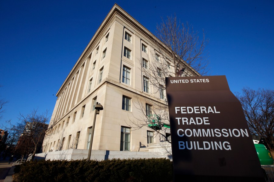 FILE - The Federal Trade Commission building in Washington is shown on Jan. 28, 2015. Financial scams, including cryptocurrency schemes, cost consumers $3.8 billion last year just in the U.S., according to the FTC. (AP Photo/Alex Brandon, File)