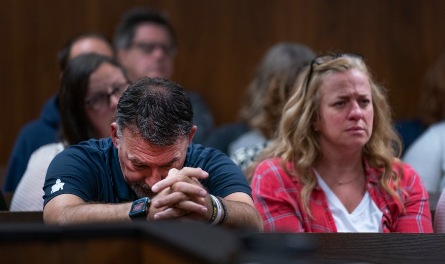 Buck Myre, left, and Sheri Myre parents of slain son Tate Myre, listen to testimony as their son's killer, Ethan Crumbley appears in the Oakland County courtroom of Kwame Rowe, on Friday, Aug. 18, 2023, in Pontiac, Mich. The judge will hear a fourth and final day of testimony Friday to determine whether Crumbley will get a life sentence for the fatal shooting of four students at a Michigan school in 2021. (Mandi Wright/Detroit Free Press via AP, Pool)