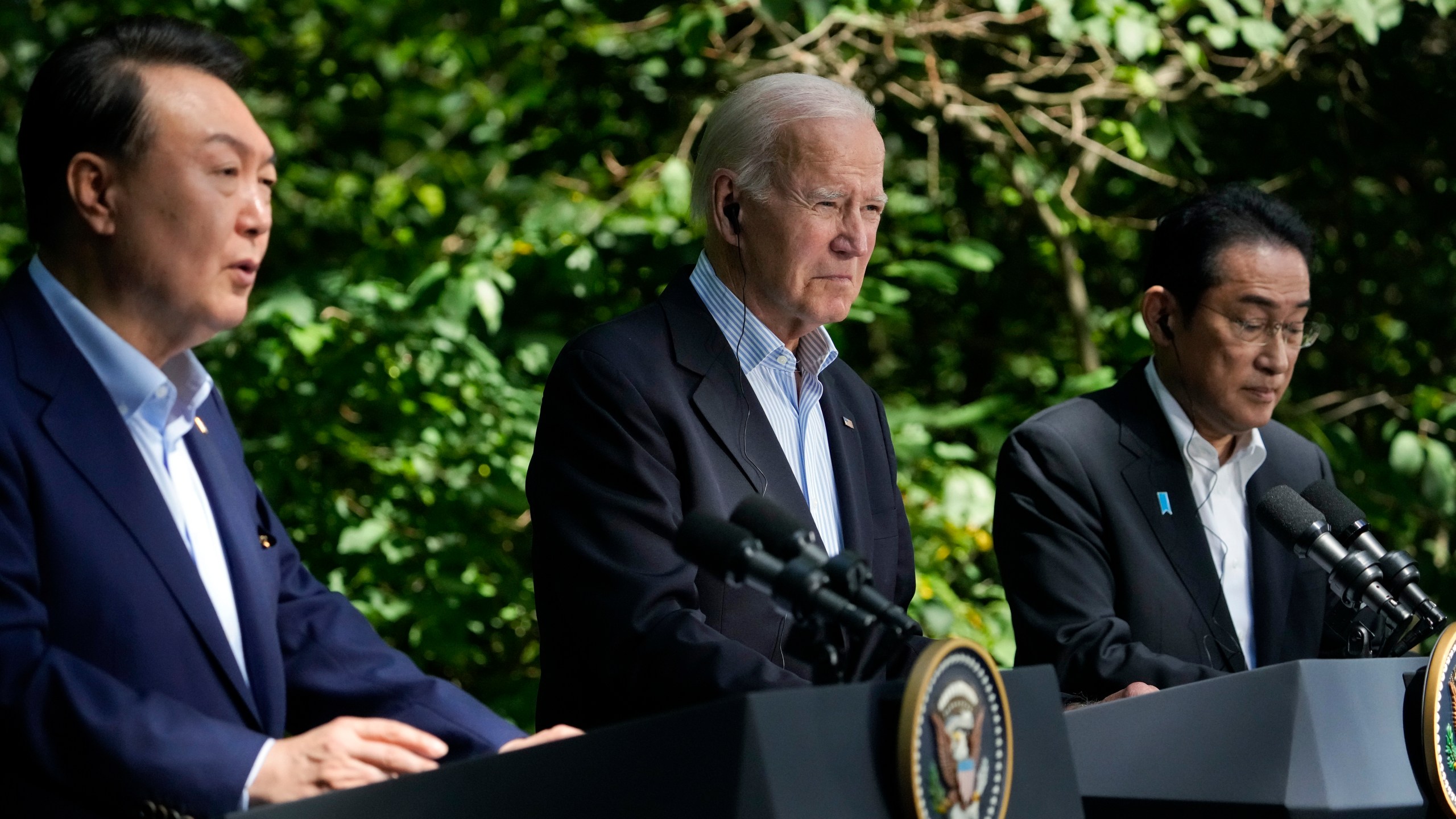 South Korea's President Yoon Suk Yeol, left, speaks during a joint news conference with President Joe Biden, center, and Japan's Prime Minister Fumio Kishida on Friday, Aug. 18, 2023, at Camp David, the presidential retreat, near Thurmont, Md. (AP Photo/Andrew Harnik)