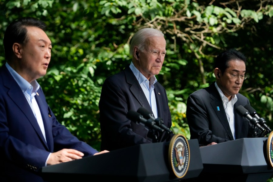 South Korea's President Yoon Suk Yeol, left, speaks during a joint news conference with President Joe Biden, center, and Japan's Prime Minister Fumio Kishida on Friday, Aug. 18, 2023, at Camp David, the presidential retreat, near Thurmont, Md. (AP Photo/Andrew Harnik)