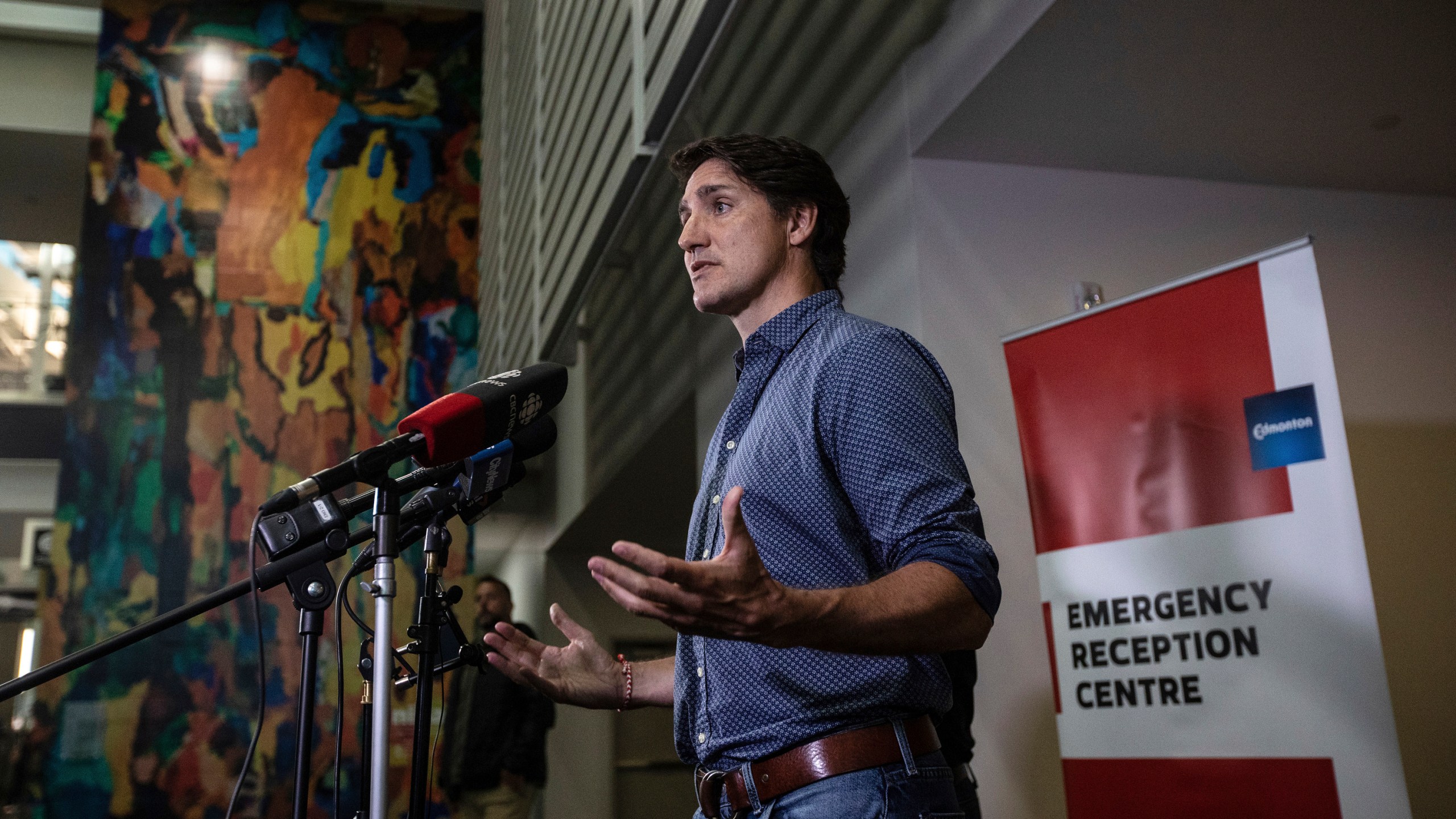 Prime Minister Justin Trudeau speaks about the wildfires in British Columbia and the Northwest Territories after visiting evacuees in Edmonton, Alberta, Friday, Aug. 18, 2023.(Jason Franson/The Canadian Press via AP)