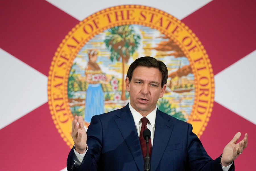 FILE - Florida Gov. Ron DeSantis speaks during a news conference to sign several bills related to public education and increases in teacher pay, in Miami, on May 9, 2023. DeSantis' divisive education policies have faced wide criticism from civil rights leaders and professional educators, among others, but they also have paid off politically. (AP Photo/Rebecca Blackwell, File)