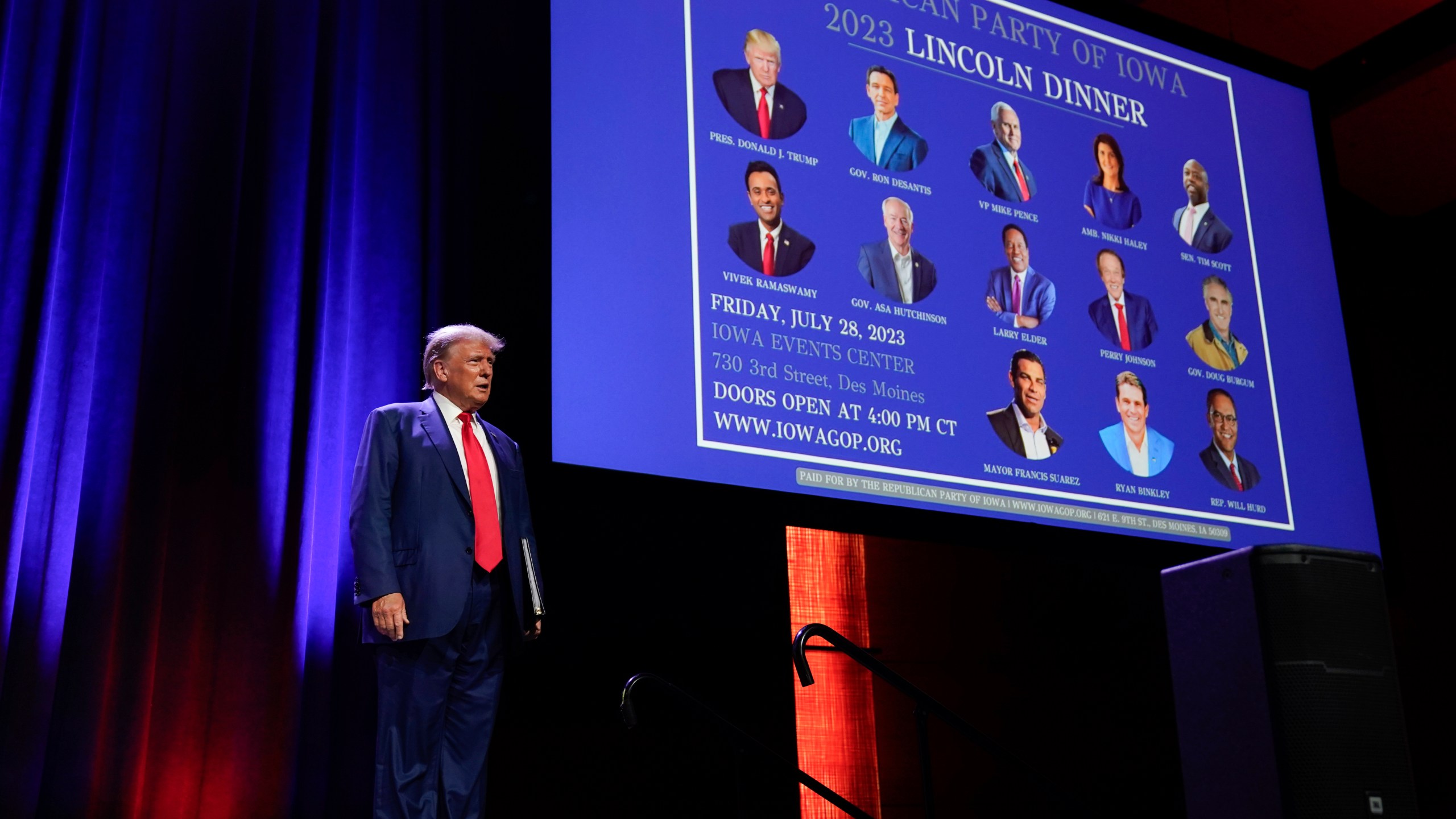 FILE - Republican presidential candidate former President Donald Trump arrives to speak at the Republican Party of Iowa's 2023 Lincoln Dinner in Des Moines, Iowa, Friday, July 28, 2023. With less than a month to go until the first 2024 Republican presidential debate, eight candidates say they have met the qualifications for a podium slot. Trump has already indicated he is likely to skip the debate and hold a competing event instead. (AP Photo/Charlie Neibergall, File)