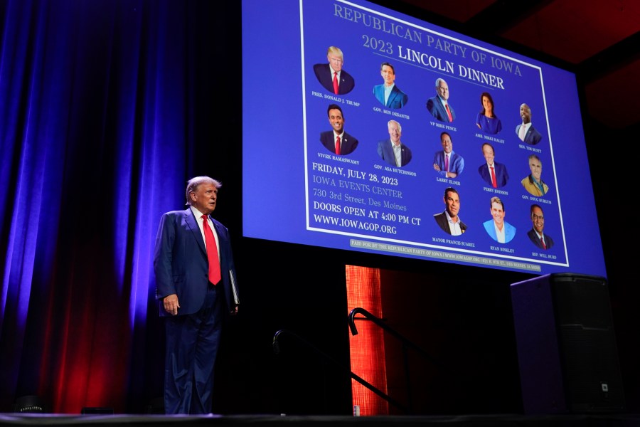 FILE - Republican presidential candidate former President Donald Trump arrives to speak at the Republican Party of Iowa's 2023 Lincoln Dinner in Des Moines, Iowa, Friday, July 28, 2023. With less than a month to go until the first 2024 Republican presidential debate, eight candidates say they have met the qualifications for a podium slot. Trump has already indicated he is likely to skip the debate and hold a competing event instead. (AP Photo/Charlie Neibergall, File)