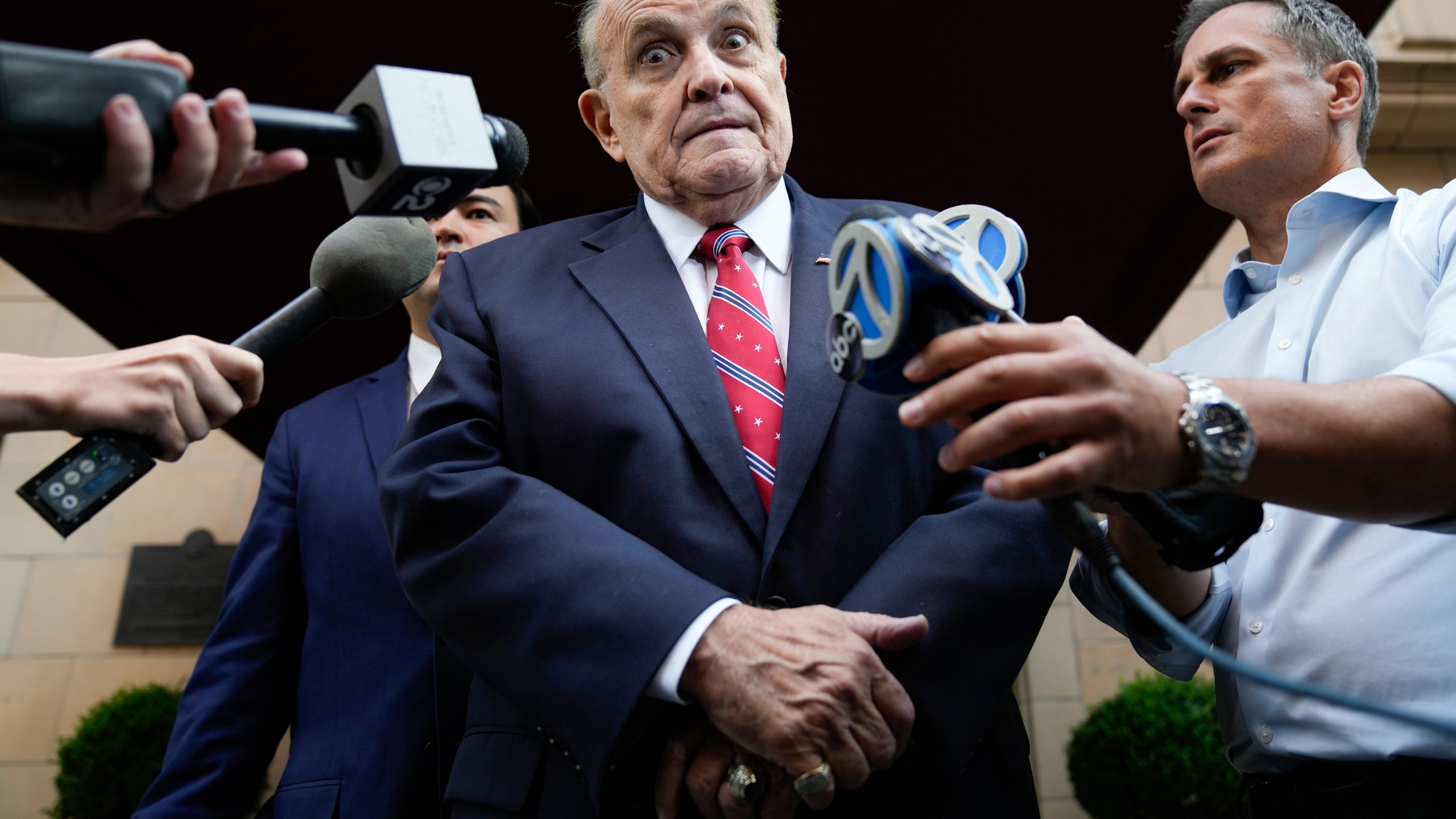 Former Mayor of New York Rudy Giuliani speaks to reporters as he leaves his apartment building in New York, Wednesday, Aug. 23, 2023. (AP Photo/Seth Wenig)