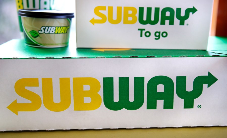 File - The Subway logo is seen on takeout boxes at a restaurant in Londonderry, N.H., on Feb. 23, 2018. The sandwich chain said Thursday it will be sold to the private equity firm Roark Capital. Terms of the deal weren't disclosed. (AP Photo/Charles Krupa, File)