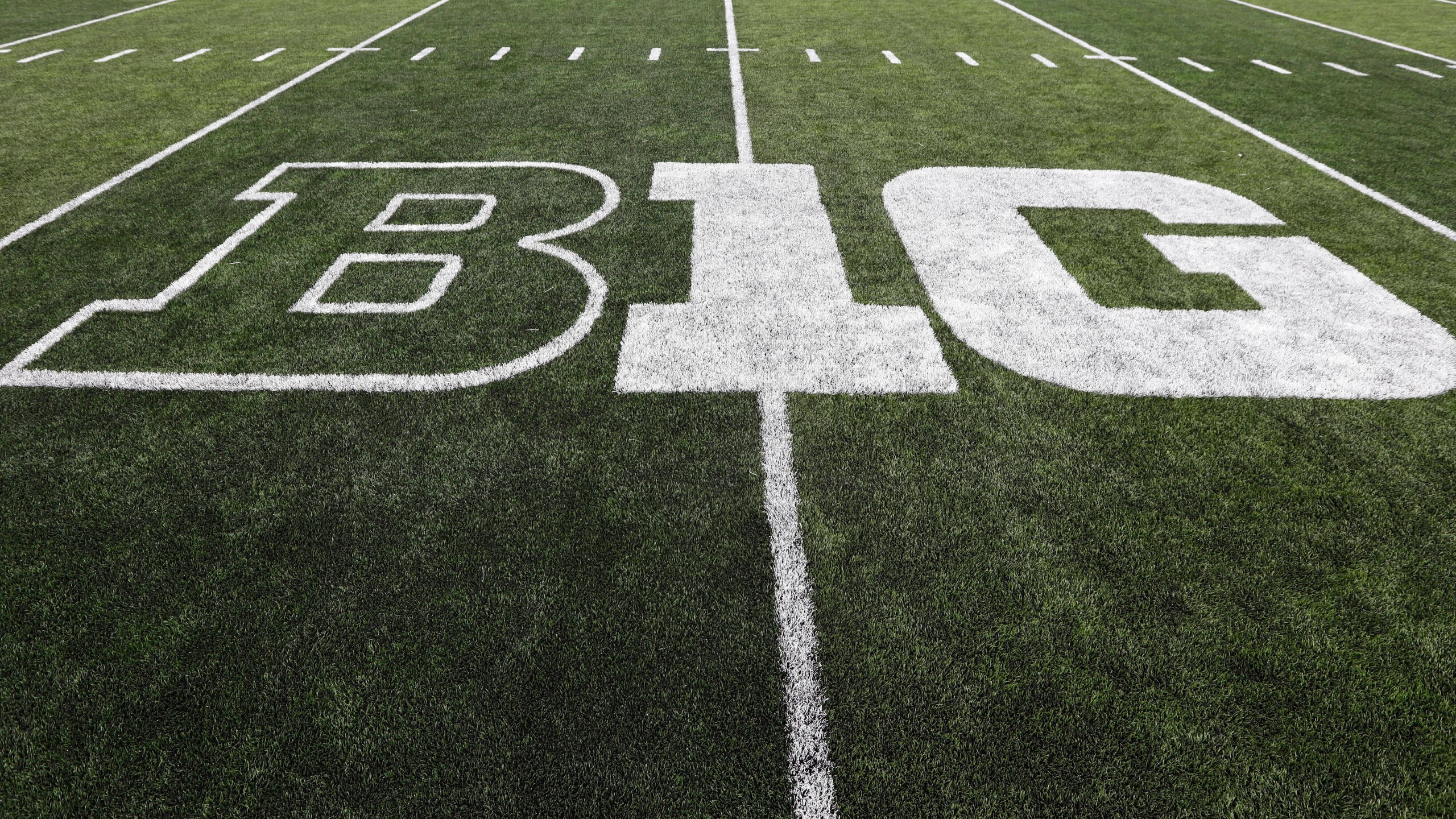 FILE - The Big Ten logo is displayed on the field before an NCAA college football game between Iowa and Miami of Ohio in Iowa City, Iowa., Aug. 31, 2019. Dealing a crushing combination to the Pac-12 on Friday, Aug. 4, 2023, the Big Ten announced Oregon and Washington would be joining the conference next August, and the Big 12 completed its raid of the beleaguered league by adding Arizona, Arizona State and Utah. (AP Photo/Charlie Neibergall, File)