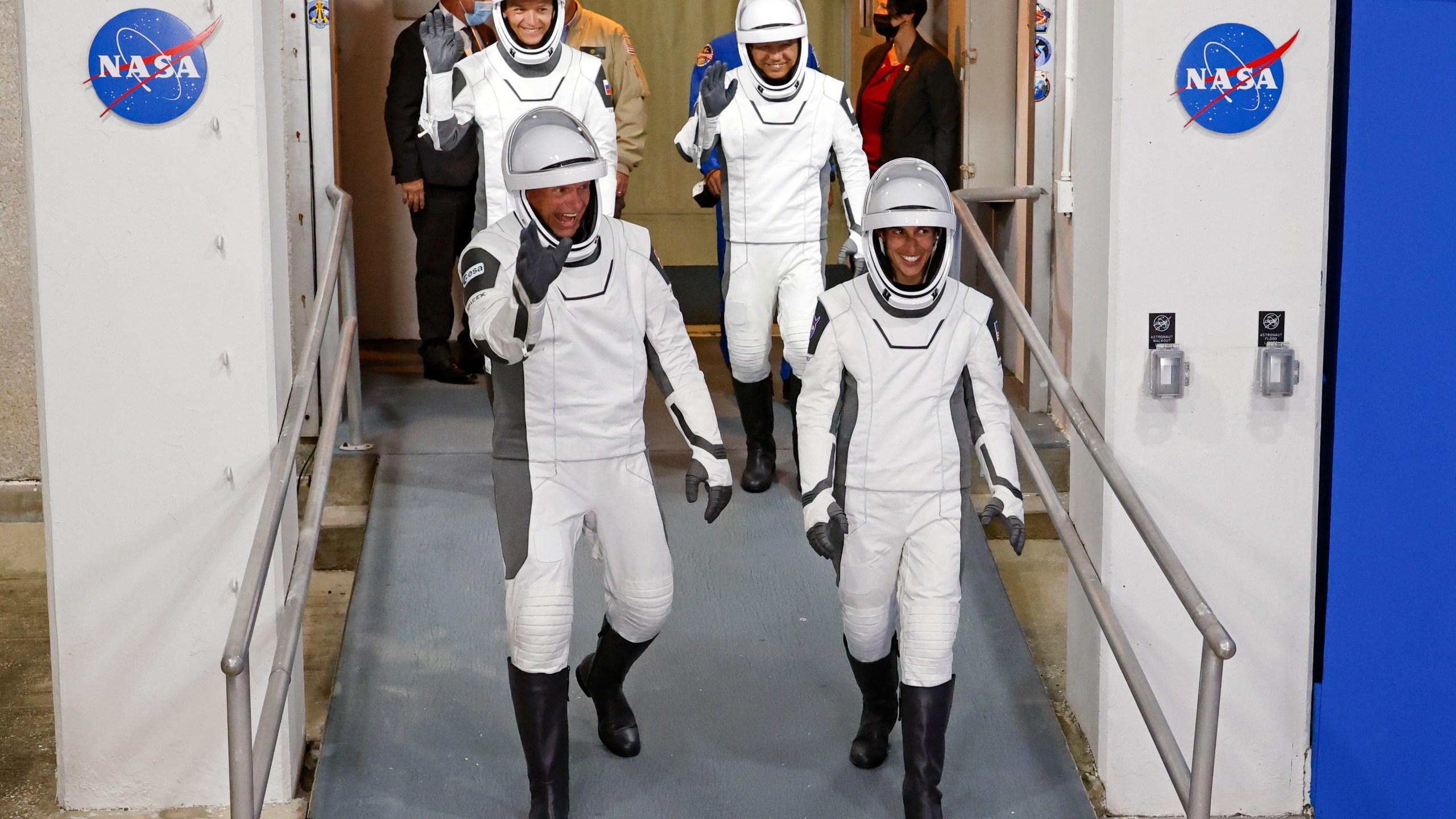 Danish astronaut Andreas Mogensen, front left, NASA astronaut Jasmin Moghbeli, front right, Russian cosmonaut Konstantin Borisov, back left, and Japanese astronaut Satoshi Furukawa leave the Operations and Checkout Building before heading to the launch pad to board the SpaceX Falcon 9 rocket on a mission to the International Space Station, at Kennedy Space Center in Cape Canaveral, Fla., early Saturday, Aug. 26, 2023. (AP Photo/Terry Renna)