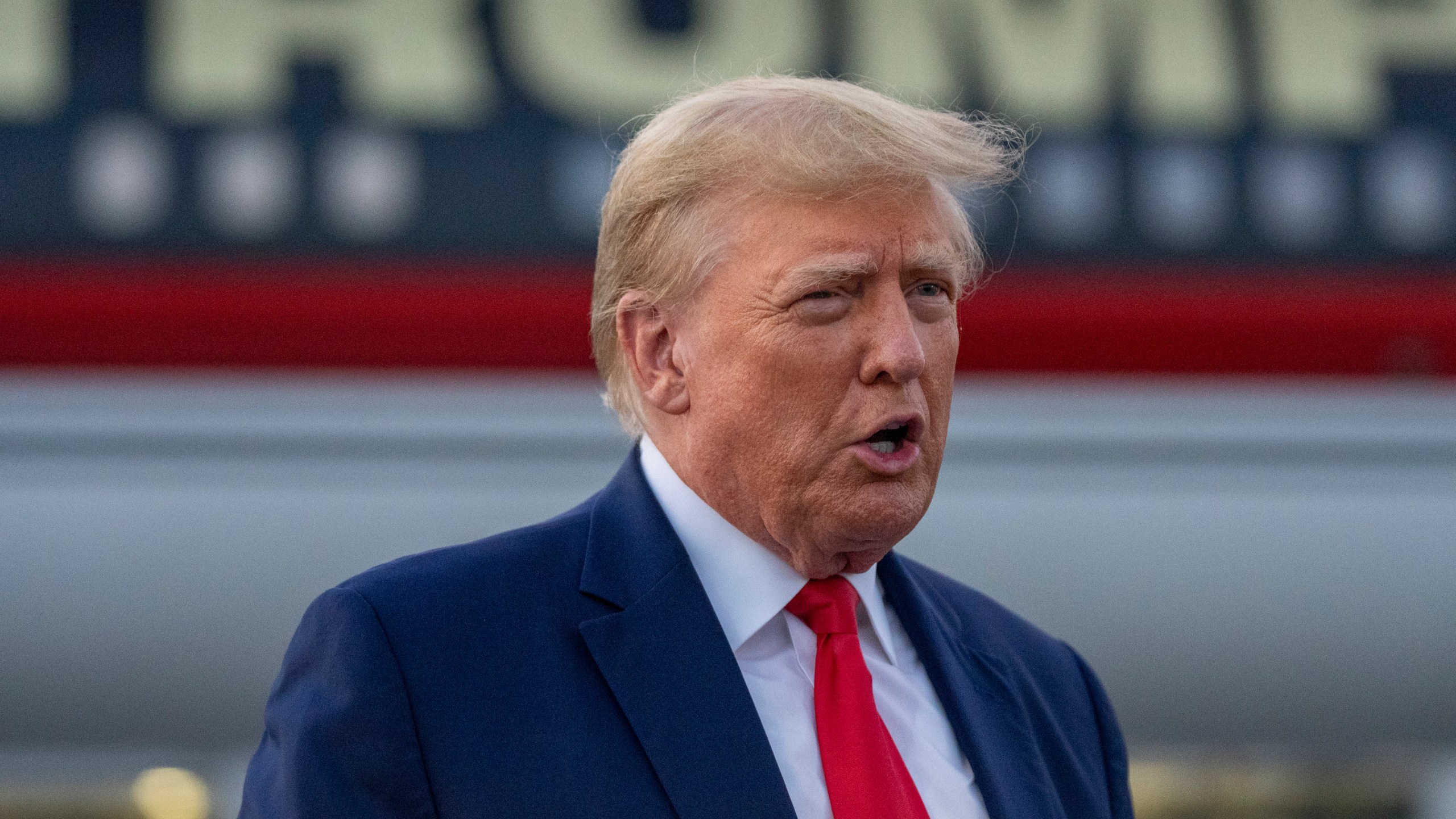 FILE - Former President Donald Trump speaks with reporters before departure from Hartsfield-Jackson Atlanta International Airport, Thursday, Aug. 24, 2023, in Atlanta. (AP Photo/Alex Brandon, File)